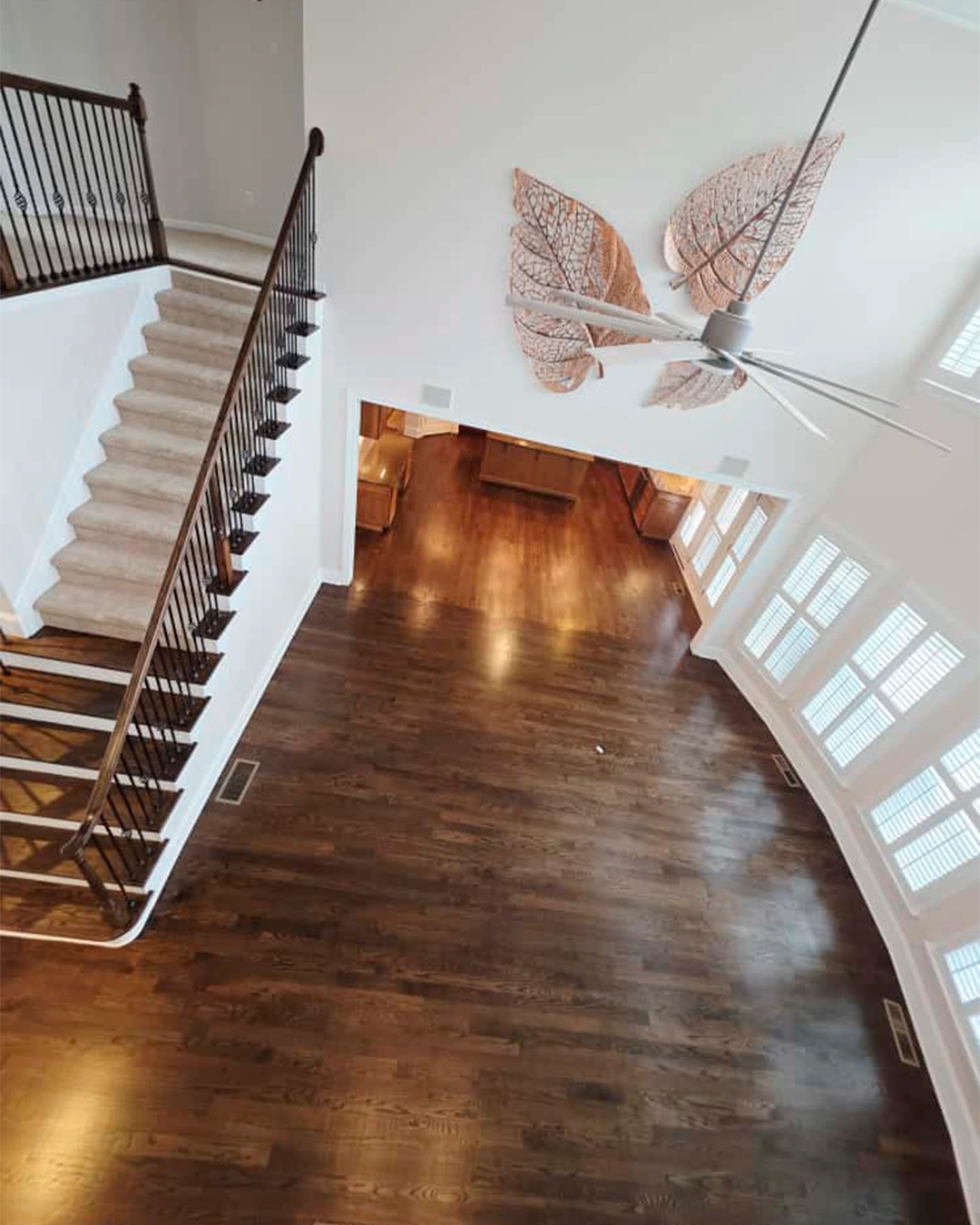 Dark hardwood flooring throughout an open-concept home
