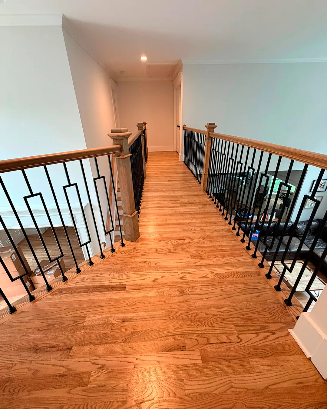 Hardwood stair treads and dark railing
