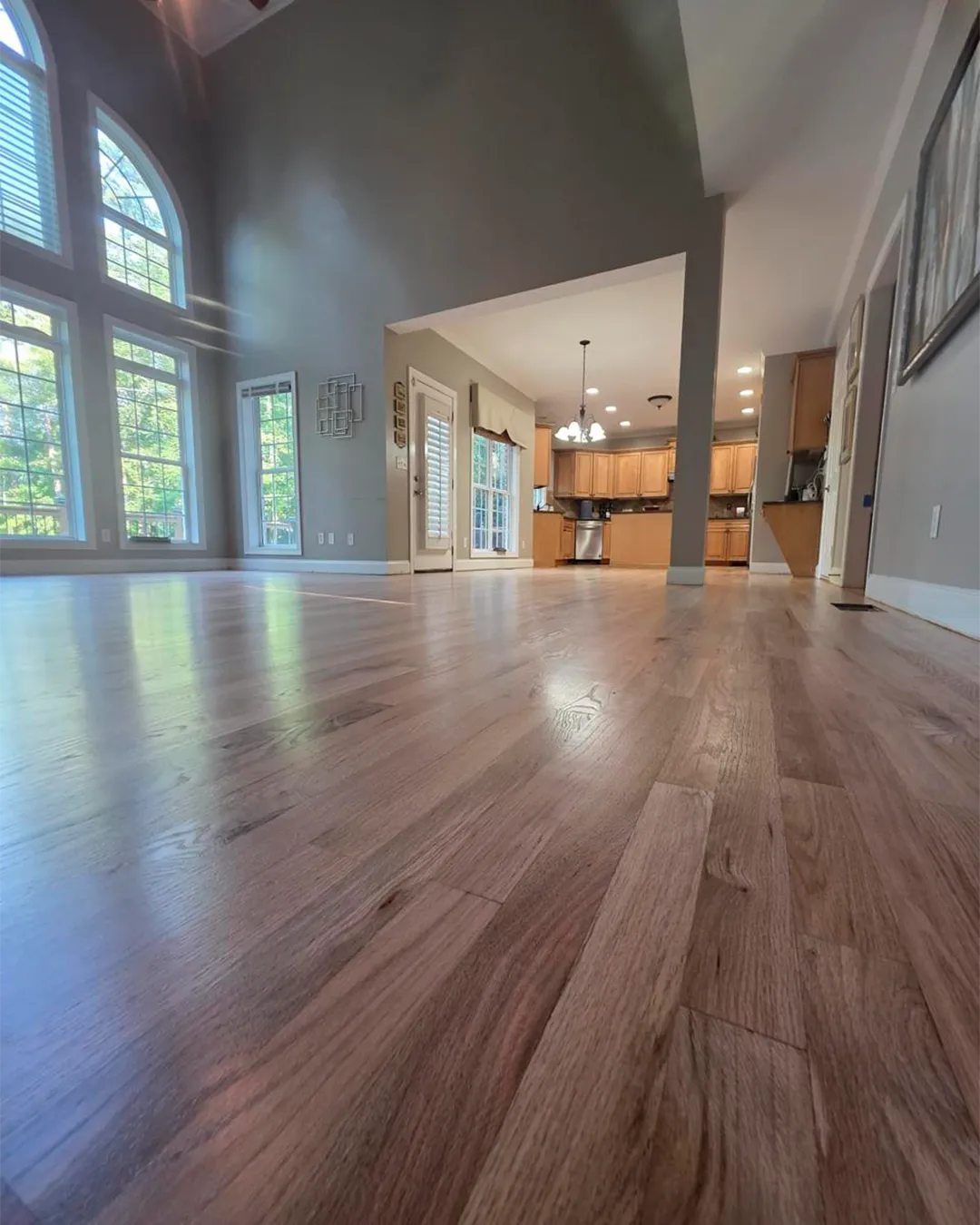 Natural hardwood flooring across an open living area